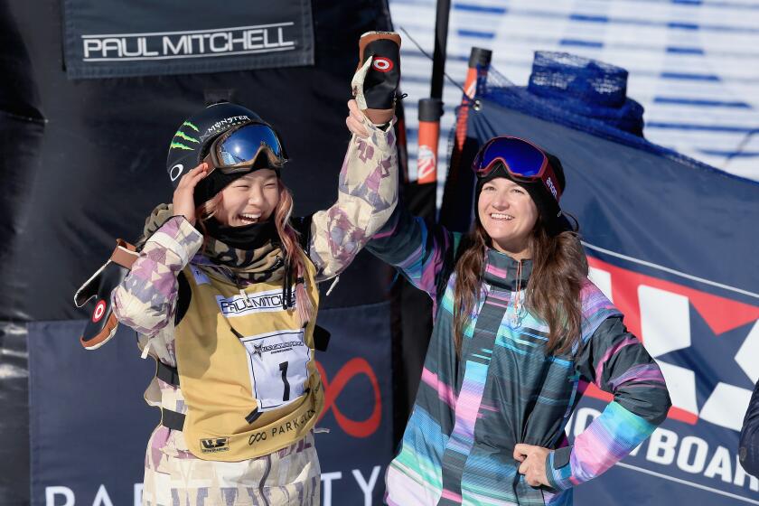 PARK CITY, UT - FEBRUARY 06: (L-R) Chloe Kim celebrates a first place finish with Kelly Clark in the ladies' FIS Snowboard World Cup at the 2016 U.S Snowboarding Park City Grand Prix on February 6, 2016 in Park City, Utah. (Photo by Tom Pennington/Getty Images)