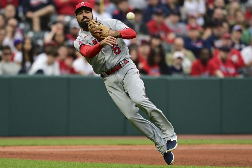 Los Angeles Angels third baseman Anthony Rendon throws to first for the out on Cleveland Guardians' Cam Gallagher during the fifth inning of a baseball game, Saturday, May 13, 2023, in Cleveland. (AP Photo/David Dermer)