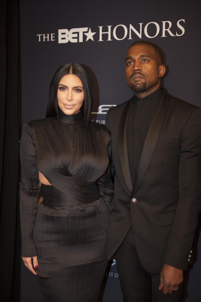 Kim Kardashian and Kanye West, both wearing Balmain, arrive on the red carpet at the BET Honors 2015 where the rapper received the Visionary Award.