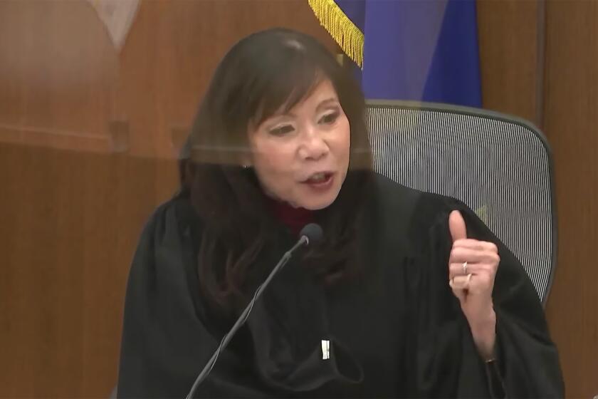 CORRECTS YEAR OF INCIDENT TO 2021 NOT 2020 In this screen grab from video, Hennepin County Judge Regina Chu presides over jury selection Tuesday, Nov. 30, 2021, in the trial of former Brooklyn Center police Officer Kim Potter in the April 11, 2021, death of Daunte Wright, at the Hennepin County Courthouse in Minneapolis, Minn. (Court TV via AP, Pool)