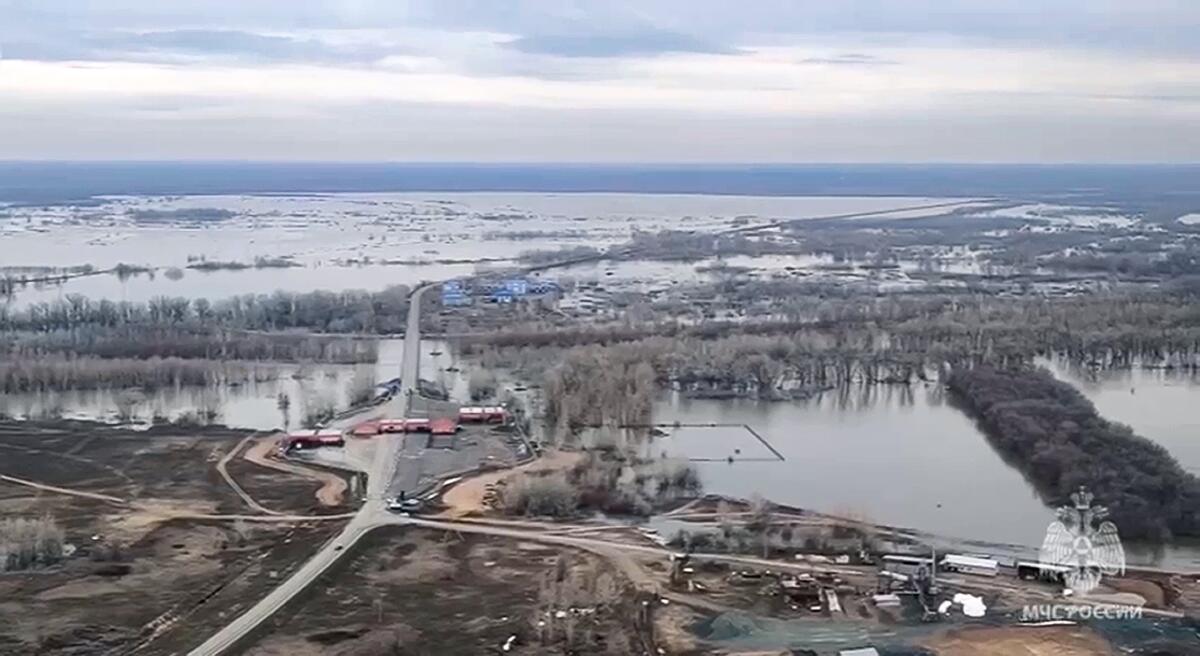 In this image taken from a video released by the Russian Emergency Ministry Press Service on Tuesday, April 9, 2024, an air-view of the flooded area in the Orenburg region, Russia. State media say Russia's government has declared the situation in flood-hit areas in the Orenburg region a federal emergency. (Russian Emergency Ministry Press Service via AP)