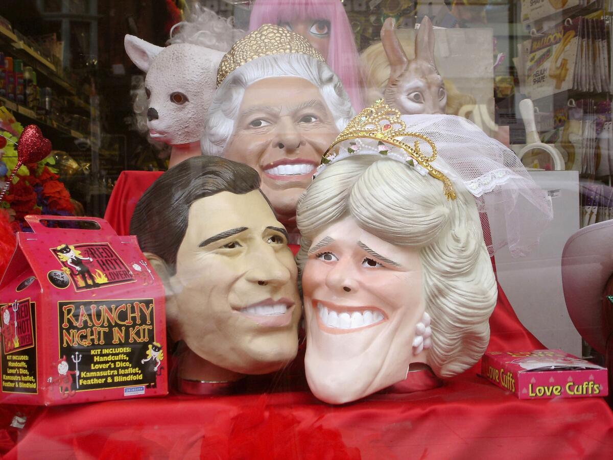Feb. 23, 2005: A joke shop in London offers masks of Prince Charles, Camilla Parker Bowles and the queen.