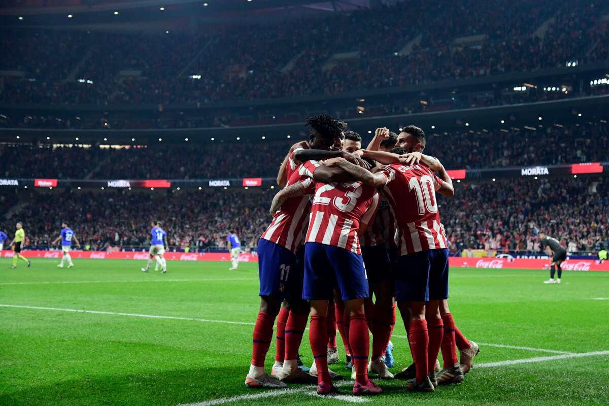Atletico Madrid's players celebrate Spanish forward Alvaro Morata's  