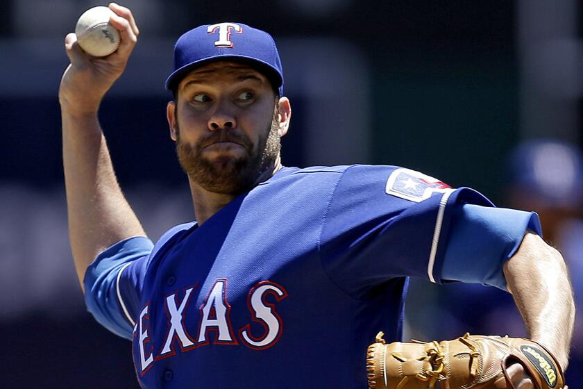 Rangers right-hander Colby Lewis had a perfect game against the A's through 7 2/3 innings Thursday.