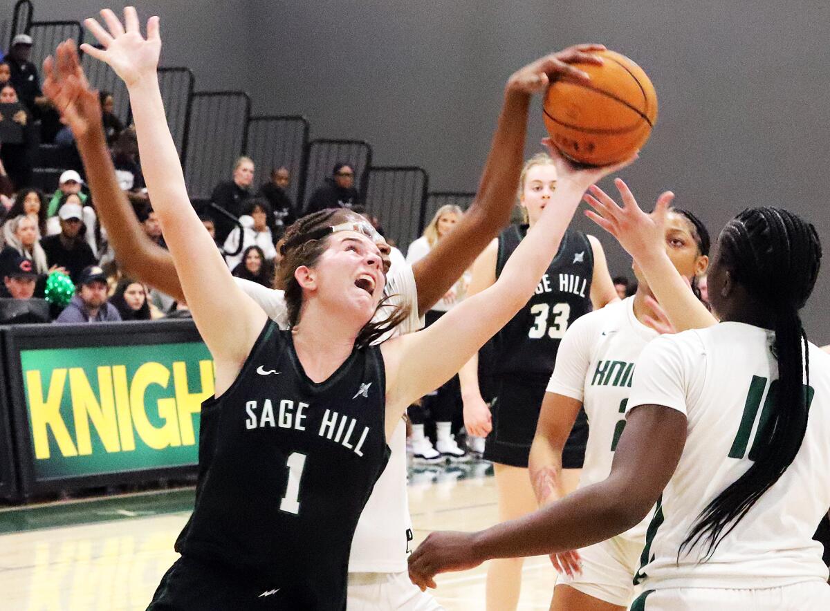 Sage Hill's Emily Eadie (1) reaches for a rebound against Ontario Christian in a playoff game.
