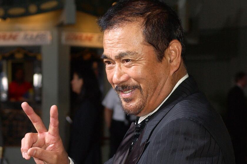 FILE - In this Sept. 29, 2003, file photo, Japanese actor Sonny Chiba arrives for the premiere of the film "Kill Bill: Volume 1" at the Grauman's Chinese Theatre in the Hollywood section of Los Angeles. Chiba, known in Japan as Shinichi Chiba, who wowed the world with his martial arts skills, acting in more than 100 films, including “Kill Bill,” has died late Thursday, Aug. 19, 2021. He was 82. (AP Photo/Kevork Djansezian, File)