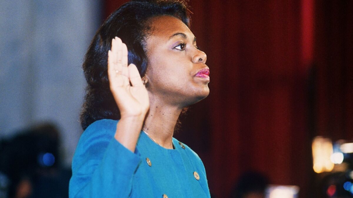 Anita Hill is sworn in for her 1991 testimony before the Senate Judiciary Committee to discuss her sexual harassment allegations against then-U.S. Supreme Court nominee Clarence Thomas.