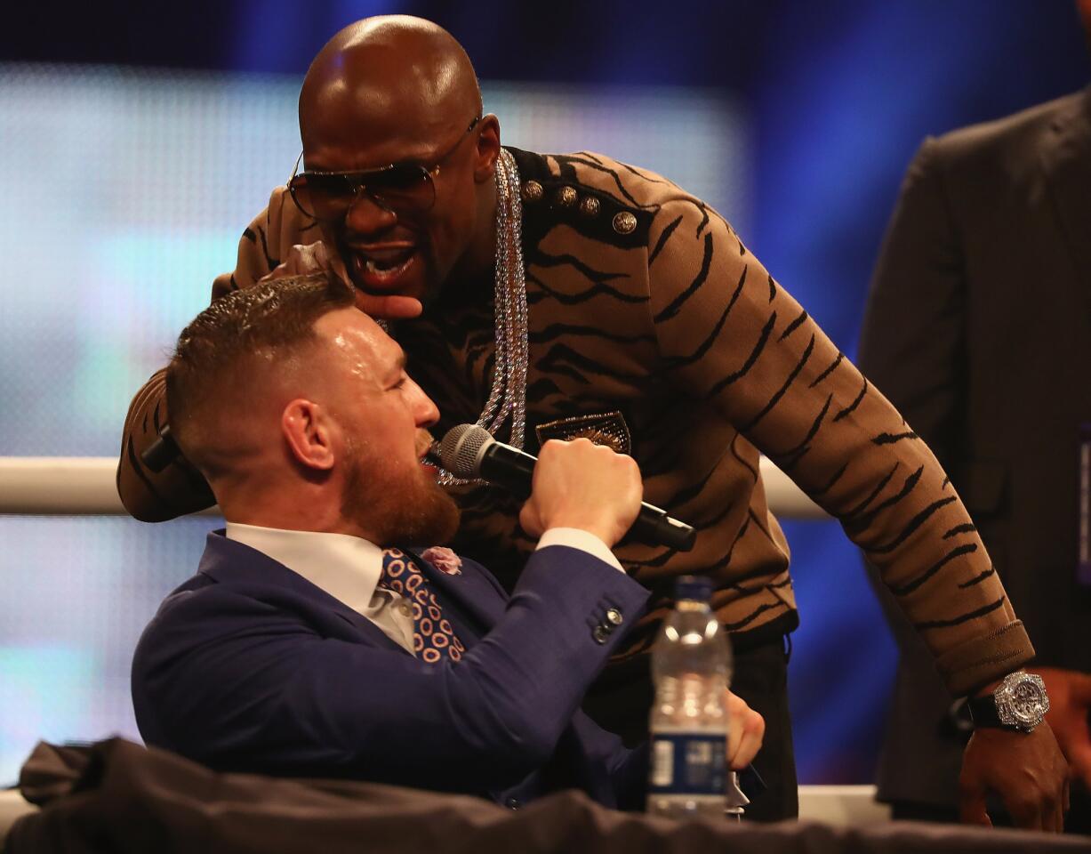 Floyd Mayweather Jr. and Conor McGregor engage in some verbal jousting at their promotional stop in London on Friday.