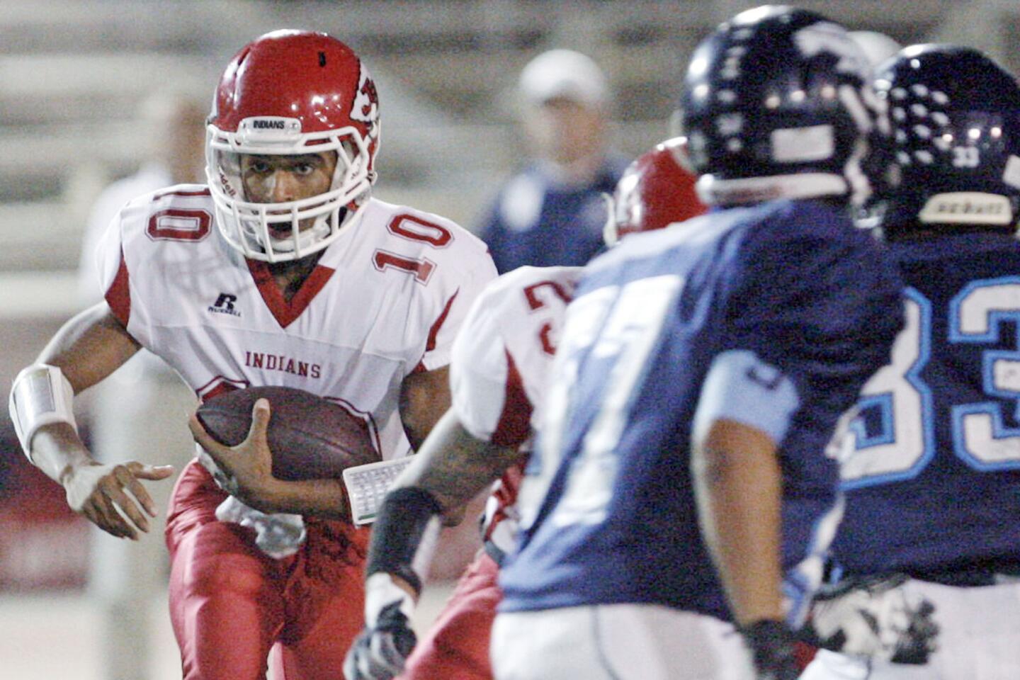Burroughs' quarterback Andrew Williams runs with the ball during a game against CV at Glendale High School on Thursday, October 4, 2012.