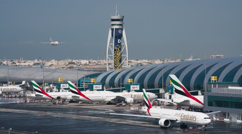 FILE - An Emirates jetliner comes in for landing at the Dubai International Airport in Dubai, United Arab Emirates, Dec. 11, 2019. Airlines across the world, including the long-haul carrier Emirates, rushed Wednesday, Jan. 19, 2021 to cancel or change flights heading into the U.S. over an ongoing dispute about the rollout of 5G mobile phone technology near American airports. (AP Photo/Jon Gambrell, File)