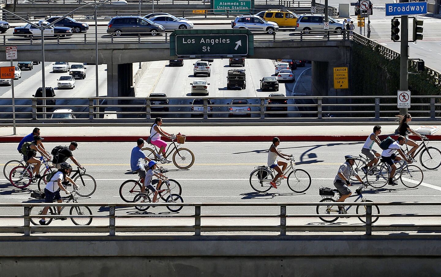 Bike riders dominate Broadway over the 101 Freeway.