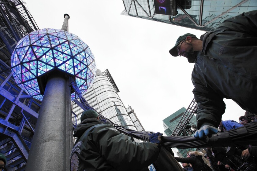 Workers prepare the Times Square ball for New Year's Eve festivities in New York.