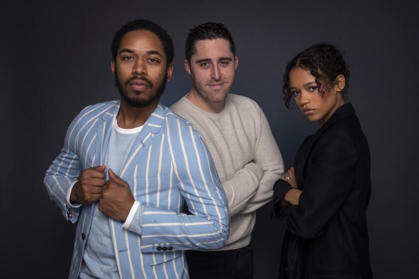 LOS ANGELES, CALIF. -- FRIDAY, OCTOBER 25, 2019: ‘‘Waves’ director Trey Edward Shults, center, and cast members Taylor Russell, right, and Kelvin Harrison Jr., left, sit for portraits at the Four Seasons Los Angeles at Beverly Hills hotel in Los Angeles, Calif., on Oct. 25, 2019. (Brian van der Brug / Los Angeles Times)