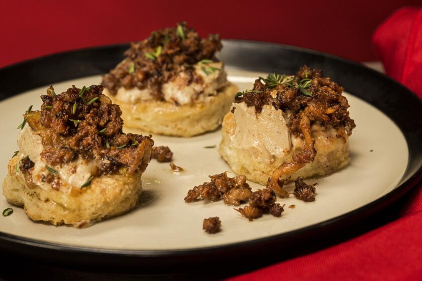 Brown butter biscuits topped with bird funk and chicken liver butter from chef Marcus Samuelsson's cookbook, "Red Rooster Cookbook."