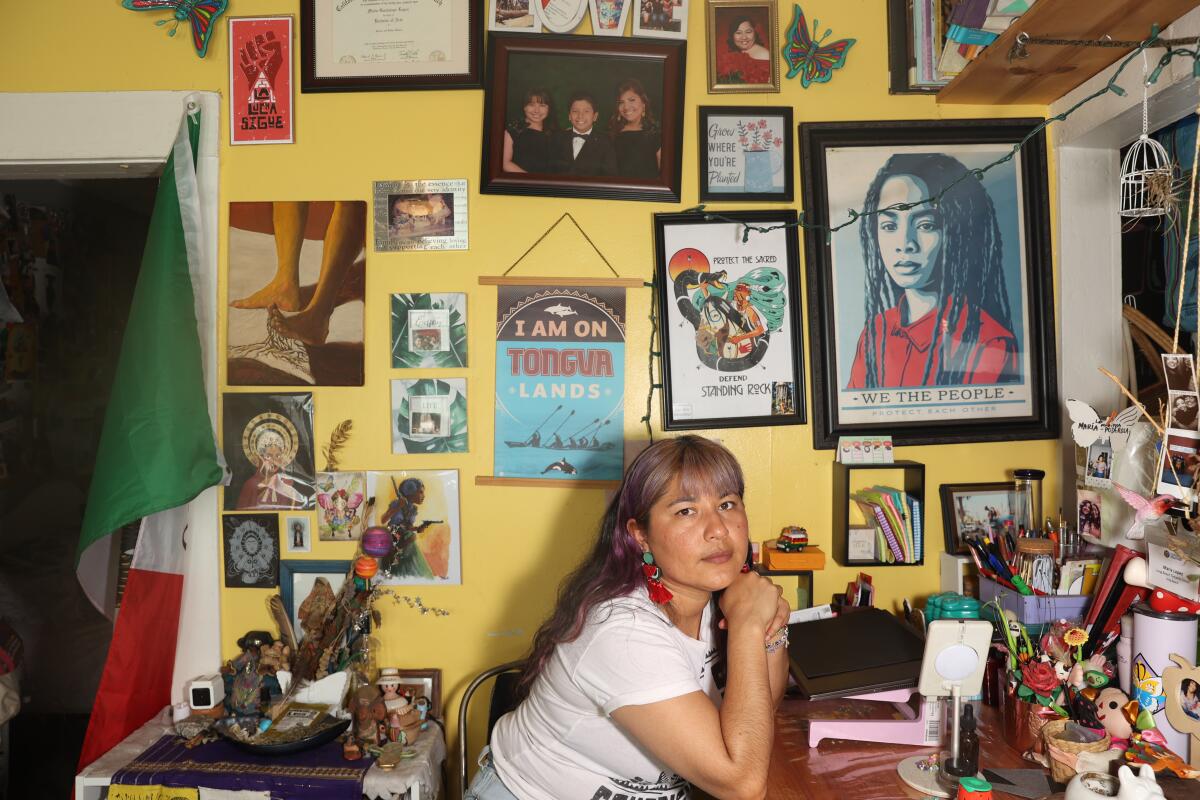 Maria Lopez poses for a portrait in her home of over three decades.