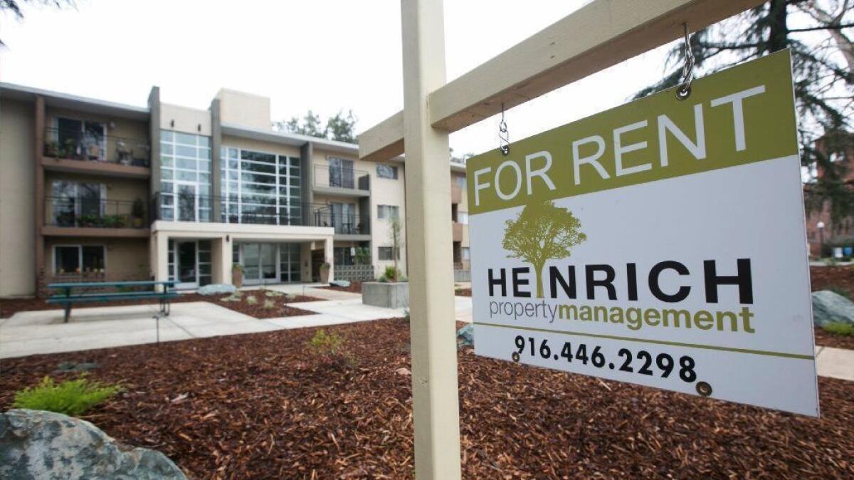 A "For Rent" sign is posted outside an apartment building in Sacramento on Oct. 6, 2018.