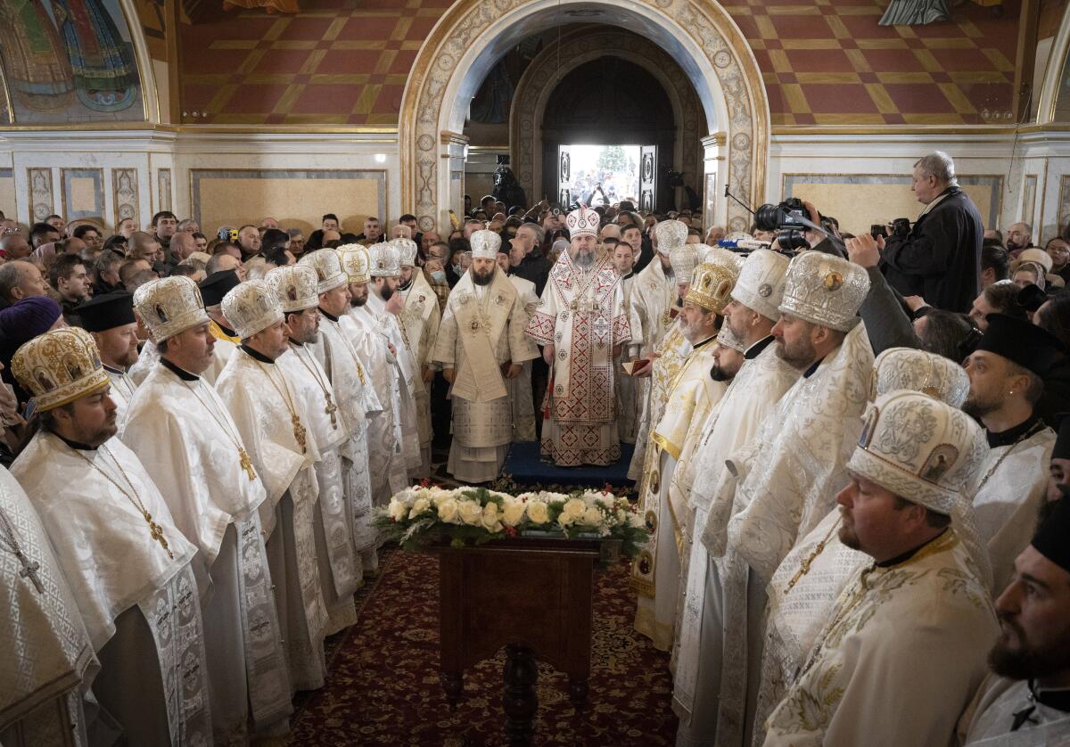 Metropolitan Epiphanius, center right, and priests deliver an Orthodox Christmas service.