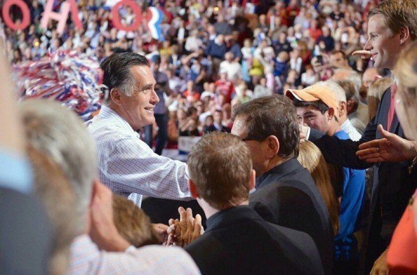Mitt Romney greets supporters at a campaign rally this week in Toledo, Ohio. As his pivotal first debate with President Obama approaches, the Republican is struggling to reignite his campaign.