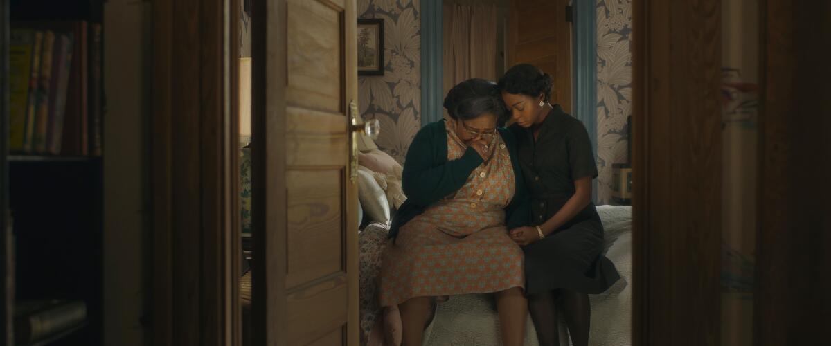 A young woman comforts an older woman in a scene from "Till."