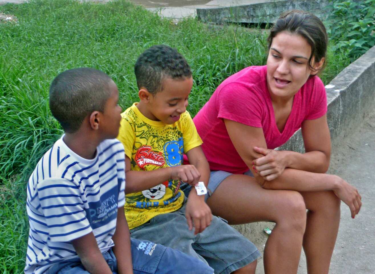 Brazilian Jiu-Jitsu champion Kyra Gracie chats with kids from an underprivileged area of Rio de Janeiro's Vargem Grande neighborhood.