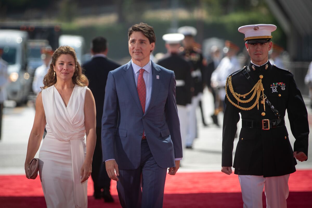 Canadian Prime Minister Justin Trudeau and his wife walk the red carpet at Inaugural Ceremony of the Summit of the Americas.