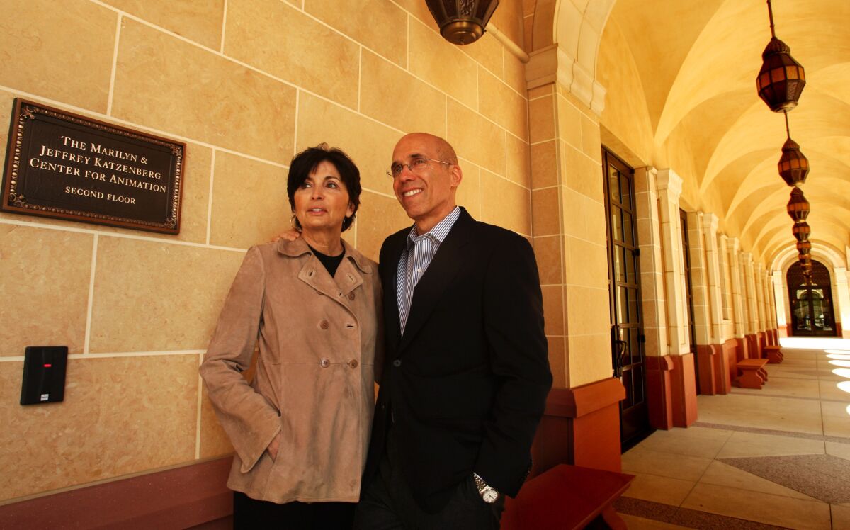 Jeffrey Katzenberg, chief executive of DreamWorks Animation, with wife Marilyn in 2011 next to a plaque that directs visitors to the Marilyn and Jeffrey Katzenberg Center for Animation inside the USC School of Cinematic Arts.