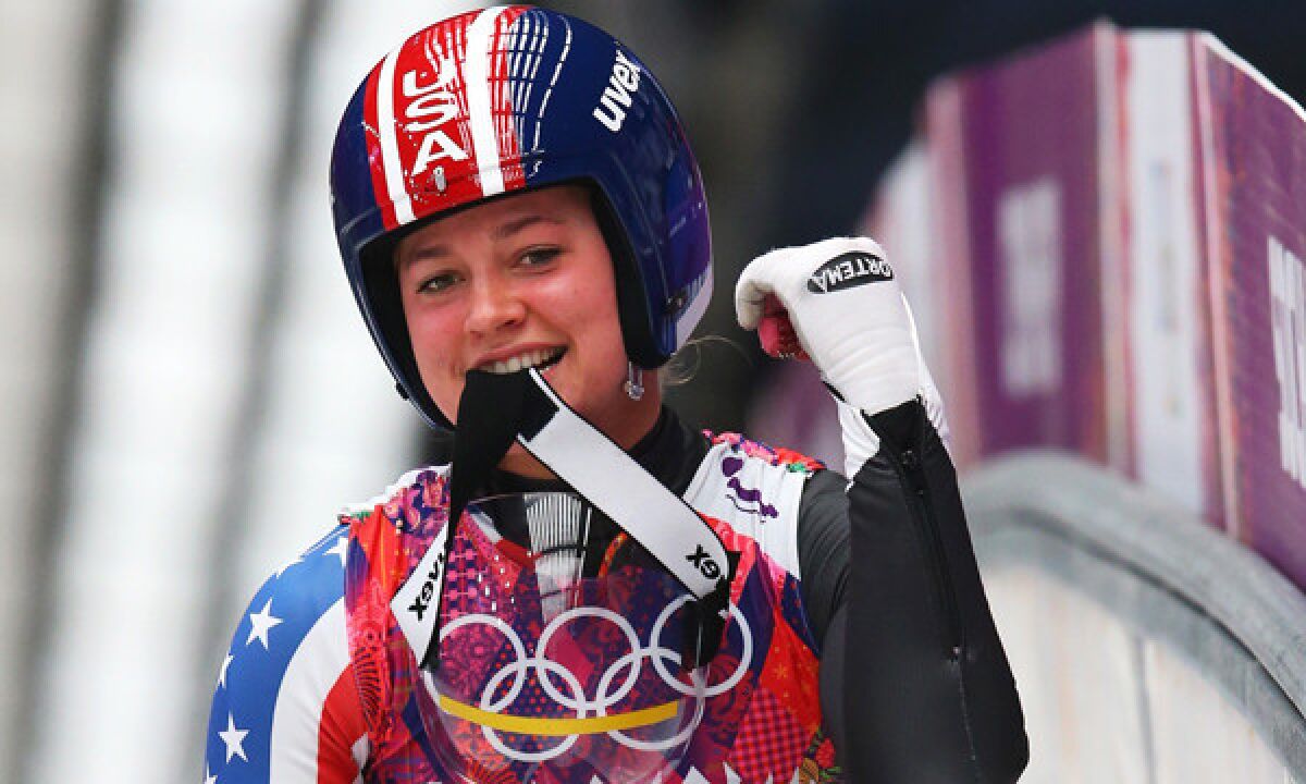 American Kate Hansen celebrates following her third luge run at the Sochi Winter Olympic Games on Tuesday. Hansen finished 10th, but the result didn't curb her enthusiasm for competing on the world's biggest stage.