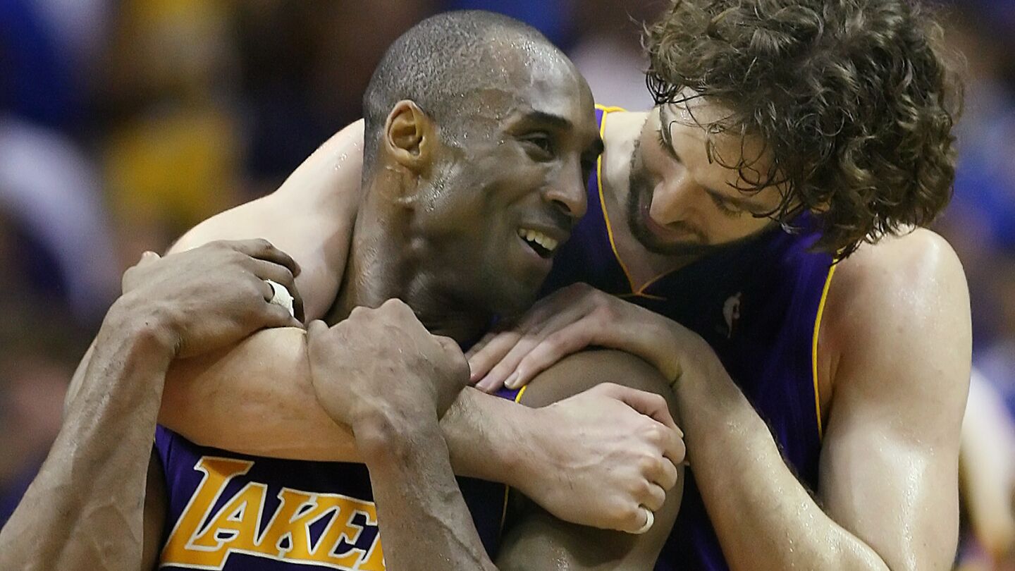 Lakers teammates Kobe Bryant and Pau Gasol, right, celebrate in the closing seconds of the team's NBA championship win over the Orlando Magic in Game 5 of the 2009 NBA Finals.