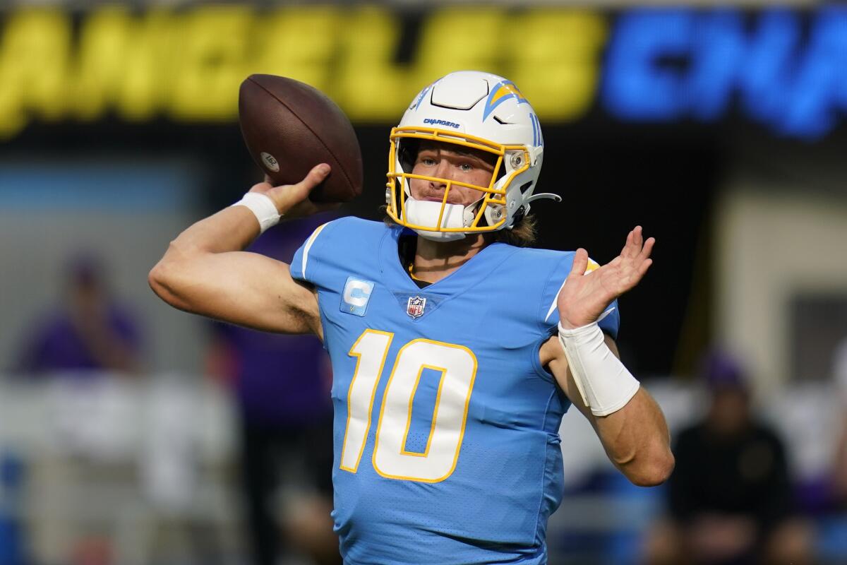 Chargers quarterback Justin Herbert throws a pass during the first half against the Minnesota Vikings.