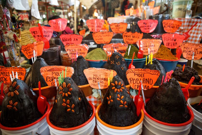 ##FOR THE FOOD TOUR STORY## MEXICO CITY, MEXICO STATE -- THURSDAY, MARCH 10, 2016: A variety of mole, a sauce used in Mexican cuisines, can be seen on sale at the La Merced Market in Mexico City, on March 10, 2016. (Marcus Yam / Los Angeles Times)