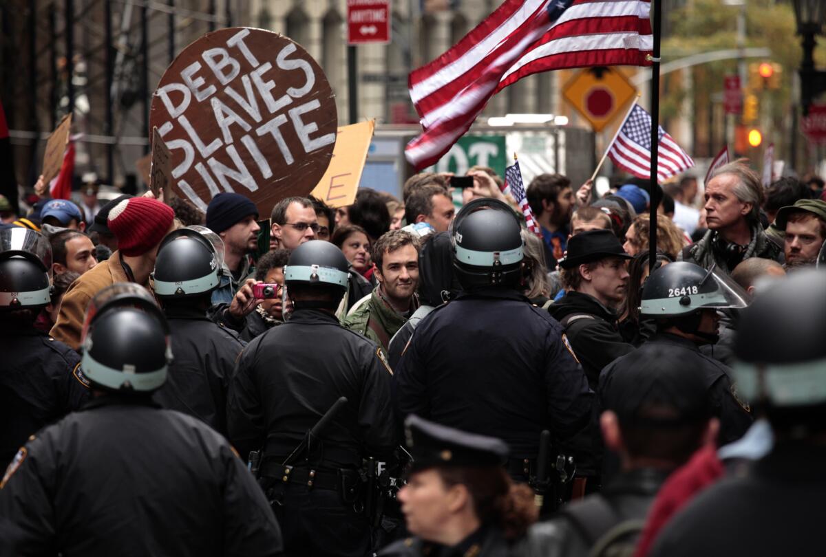 The wages of income inequality: Occupy Wall Street protesters clash with police in 2011.