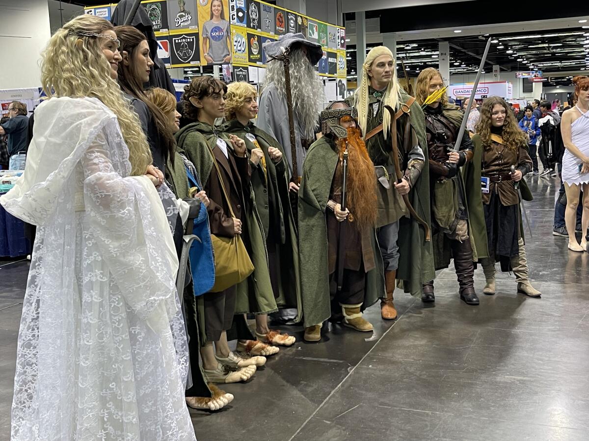 Cosplayers dressed as "Lord of the Rings" characters pose at WonderCon inside the Anaheim Convention Center.