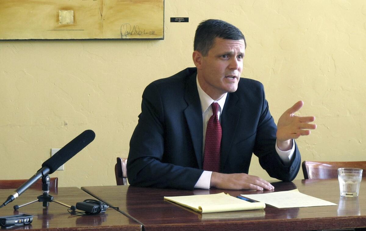 Troy Kelley takes questions at a news conference in Olympia, Wash., during his successful 2012 campaign for state auditor. In an indictment unsealed Thursday, a federal grand jury charged Kelley with filing false tax returns, obstruction of justice and possession of stolen property.