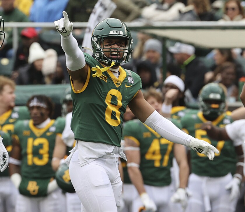 Baylor safety Jalen Pitre shouts to his teammates in the first half of an NCAA college football game against Texas Tech, Saturday, Nov. 27, 2021, in Waco, Texas. (AP Photo/Jerry Larson)