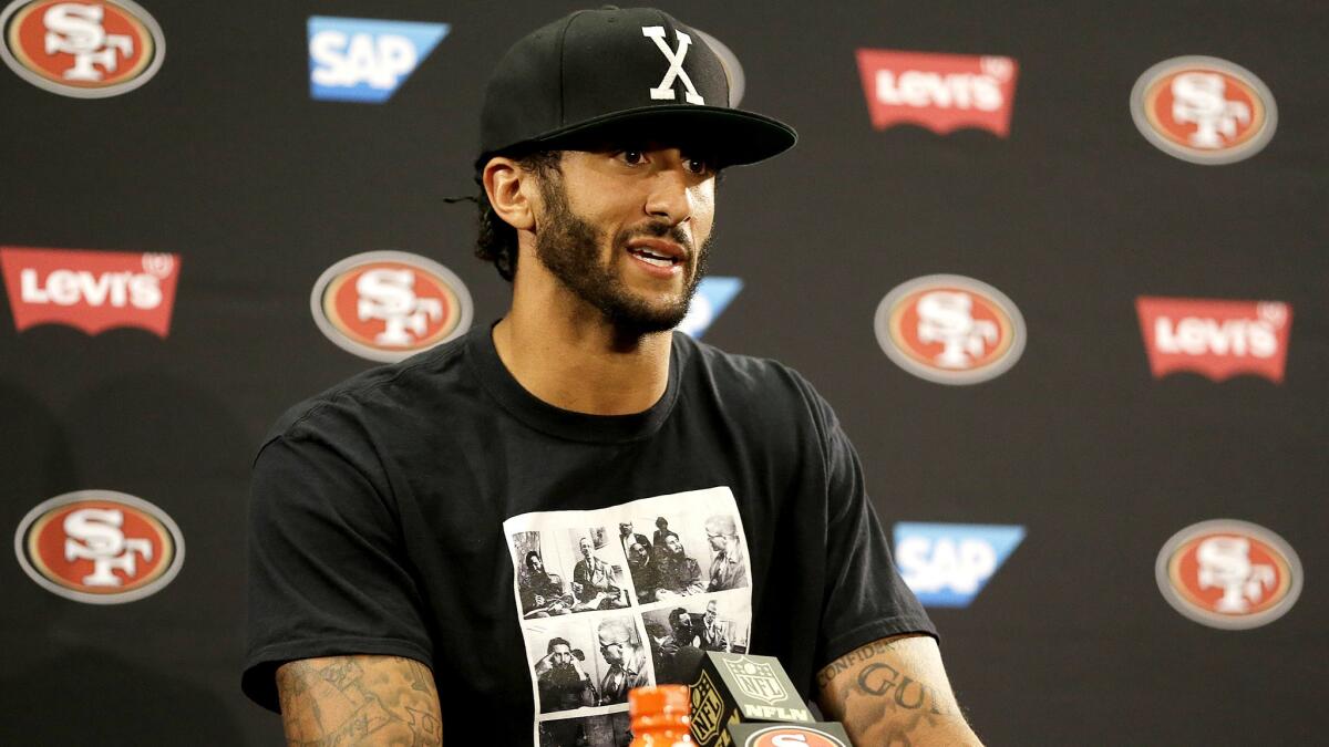 49ers quarterback Colin Kaepernick addresses the media after a preseason game against the Packers.