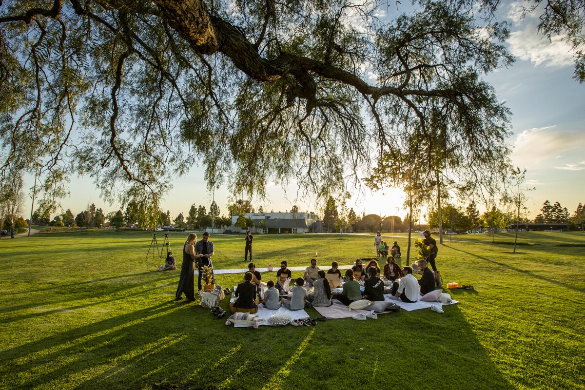 Victims of anti-Asian hate attacks meet for a peaceful picnic in Fountain Valley Sports Park on Thursday.