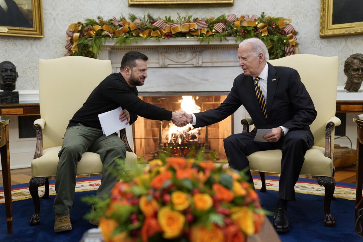 President Biden and Ukrainian President Volodymyr Zelensky meet in the Oval Office of the White House on Dec. 12. 