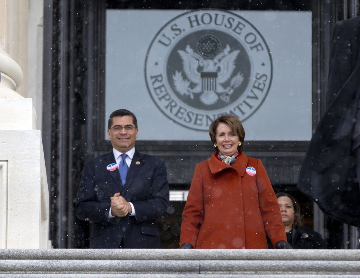 Rep. Xavier Becerra (D-Los Angeles) and House Minority Leader Nancy Pelosi of San Francisco walk with other House Democrats and immigration leaders to gather on the steps of the Capitol. Democrats sought to force a vote on immigration reform.