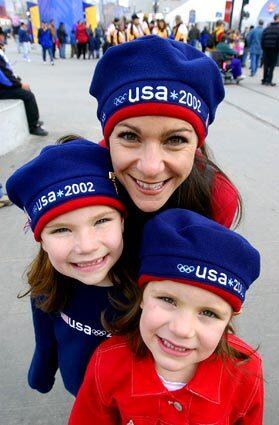 Sherri Steele and daughters Madeline, 7, left, and Sydney, 5, show off their Team USA berets during the Salt Lake City Winter Olympic Games in 2002. After the hats were worn by Katie Couric and Matt Lauer on The Today Show and the U.S. athletes during the opening ceremonies, Roots Canada sold more than a million of them. The company had to ramp up production and charter a flight to Salt Lake City filled with boxes of berets to meet demand.