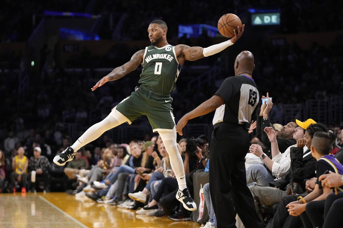 Lillard scores 14 points in Milwaukee debut as Bucks beat Lakers - The San  Diego Union-Tribune