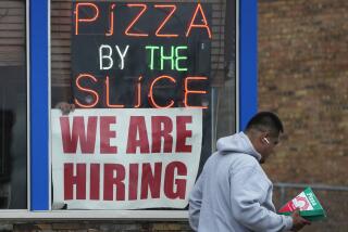 FILE - A hiring sign is displayed at a restaurant in Prospect Heights, Ill., on April 4, 2023. The hot jobs market has been defying a weakening economy and confounding the Federal Reserve for months, but now shows signs of cooling. The latest set of employment data from the government shows that job openings fell in March to their lowest level since April 2021. Layoffs rose to 1.8 million, their highest level since December 2020. (AP Photo/Nam Y. Huh, File)