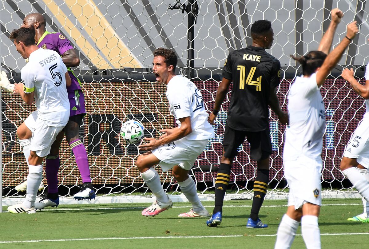 The Galaxy's Ethan Zubak, center, celebrates his goal against LAFC in the first half Aug. 22, 2020.