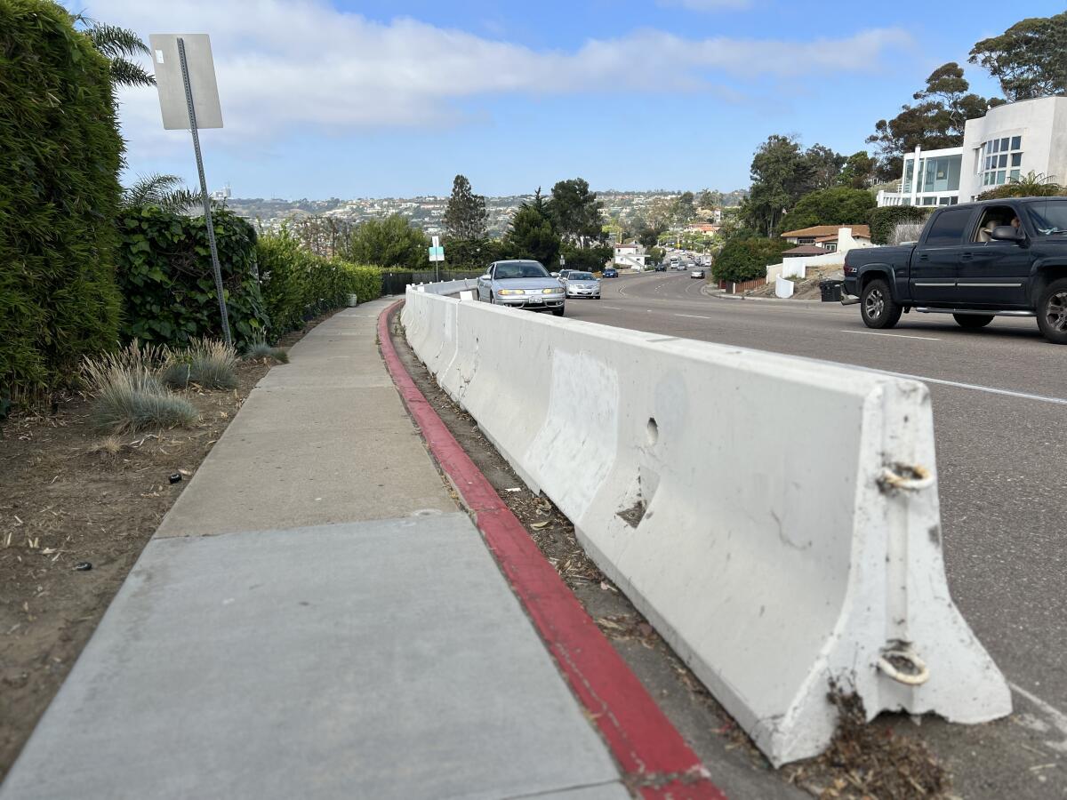 A new guardrail is coming to replace this K-rail along Torrey Pines Road between Prospect Place and Coast Walk in La Jolla.