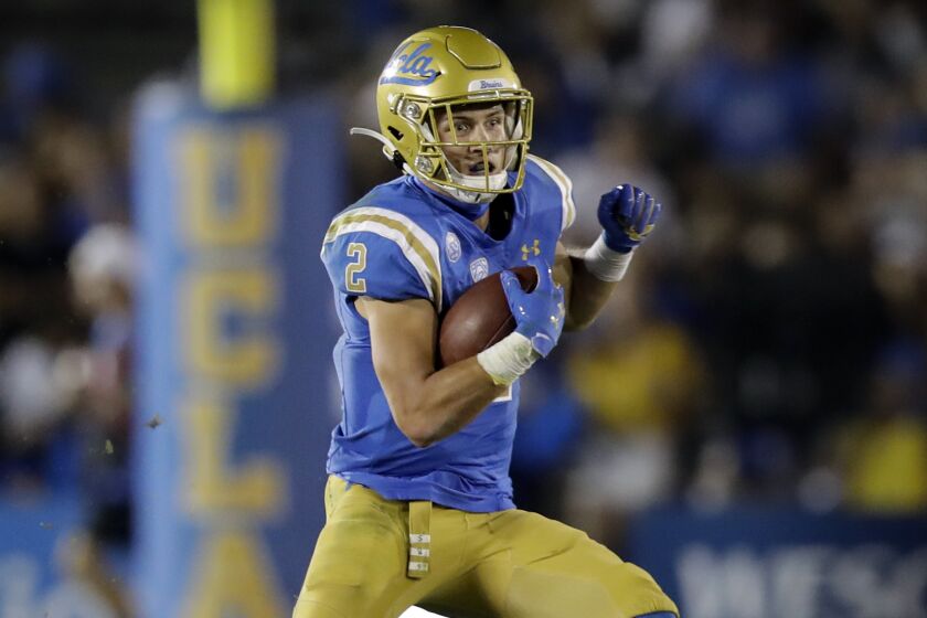 UCLA wide receiver Kyle Philips (2) runs against Arizona State during the second half.