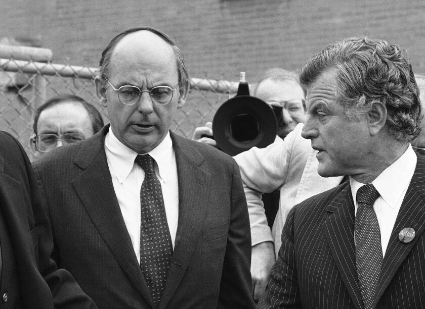 FILE - In this Oct. 14, 1982, file photo, Illinois Democratic gubernatorial candidate Adlai Stevenson III, left, talks with Sen. Edward Kennedy, right, talk as they finish a series of appearances in Chicago. Stevenson III, of Illinois, has died at his home on Chicago’s North Side. He was 90. On Tuesday, Sept. 7, 2021, his son Adlai Stevenson IV confirmed the Democrat’s death and said his father had dementia. (AP Photo/File)