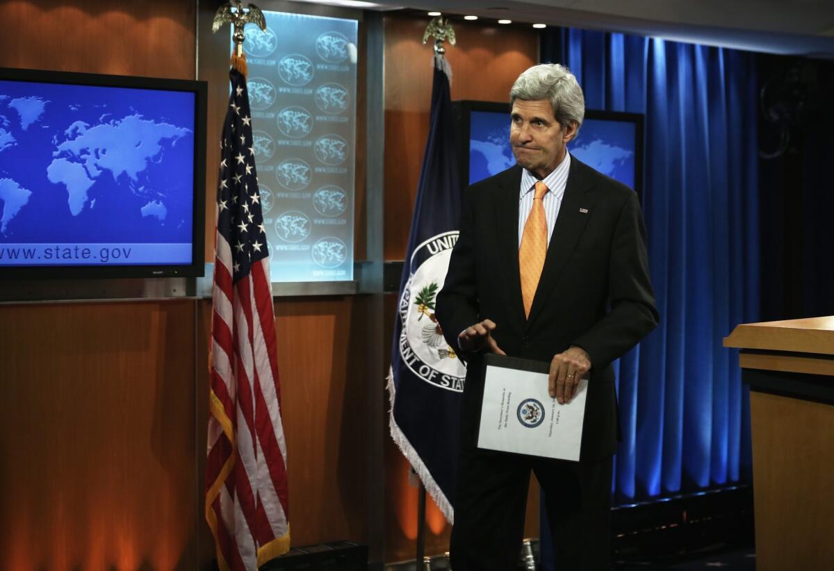 Secretary of State John F. Kerry leaves after an impromptu news conference Thursday at the State Department.