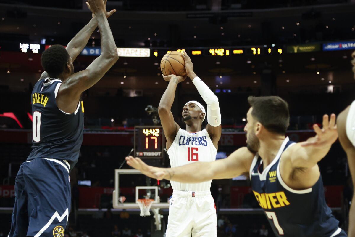 Clippers forward Harry Giles III shoots against Denver Nuggets forward JaMychal Green.