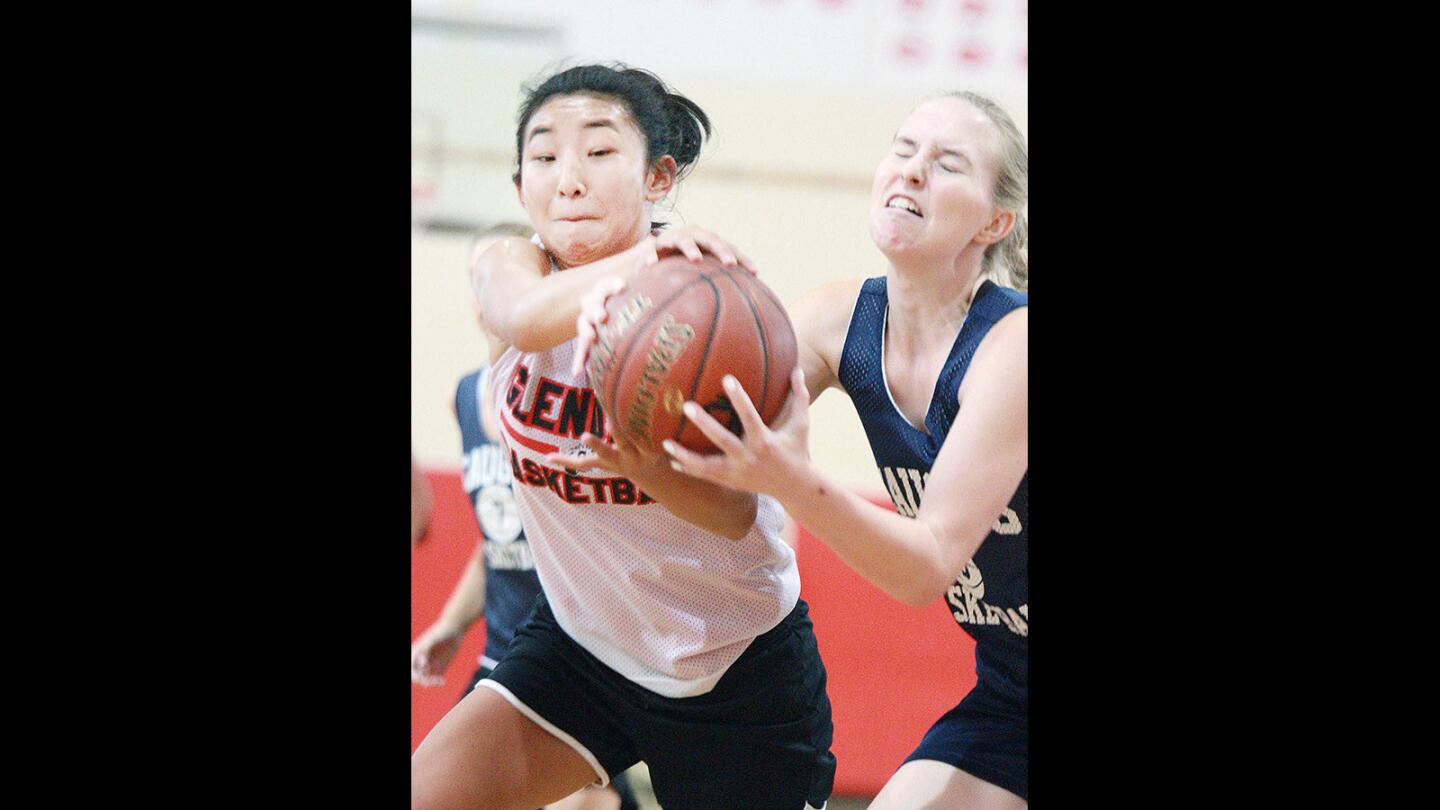 Glendale's Jillian Yanai battles for a loose ball against Saugus in a Burroughs High School summer league girls' basketball game on Tuesday, June 21, 2016.