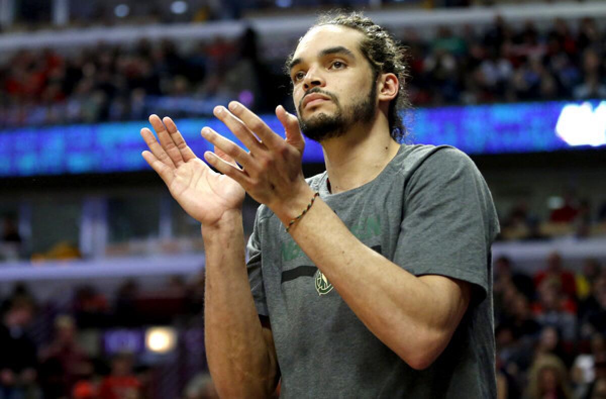Bulls center Joakim Noah applauds his teammates' effort during a 102-90 victory over the Milwaukee Bucks earlier this month in Chicago.
