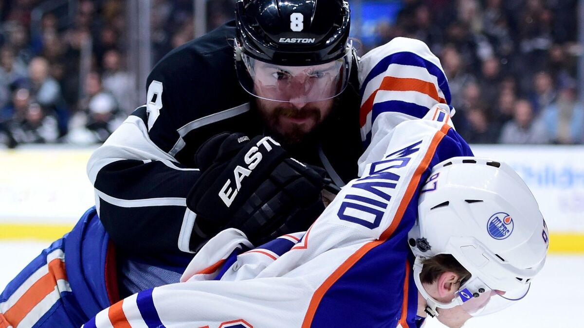 The Kings' Drew Doughty, top, pushes Edmonton's Connor McDavid on Feb. 25, 2016, at Staples Center.